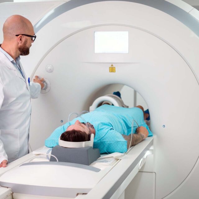 doctor and patient using mri machine