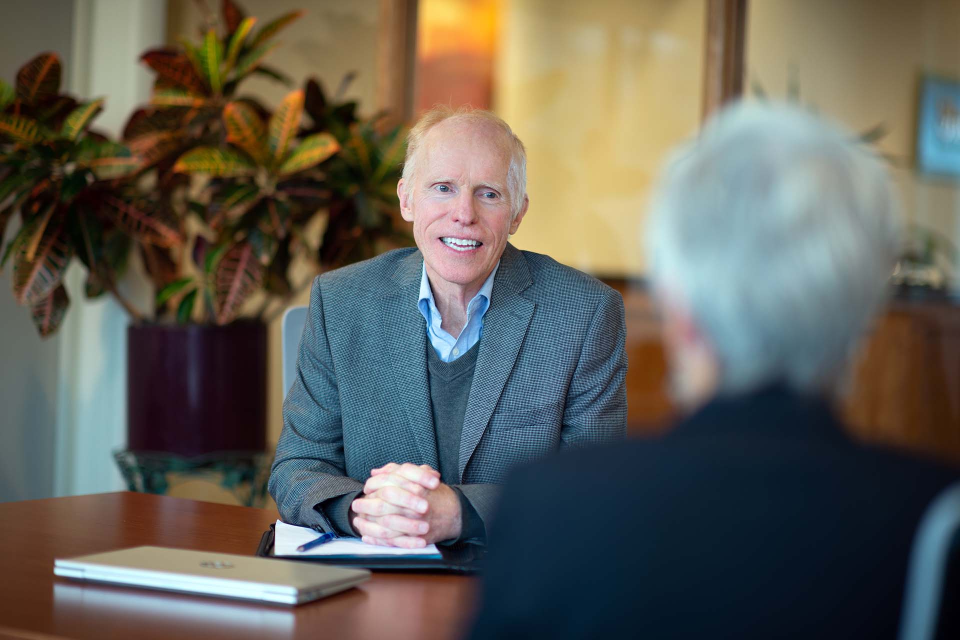 Sheehey attorney smiling at table during meeting