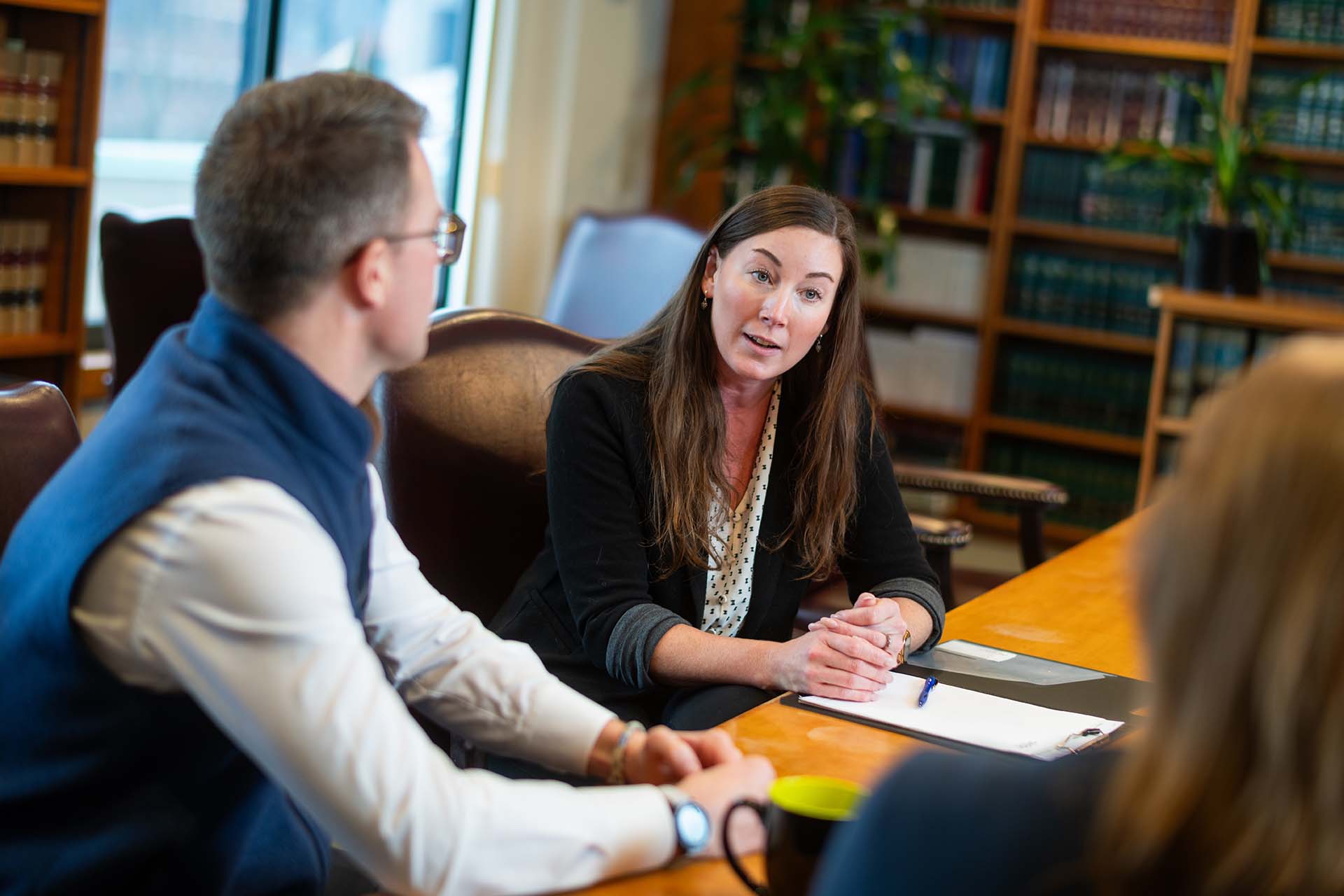 Sheehey Attorney meeting with clients at table in a conference room